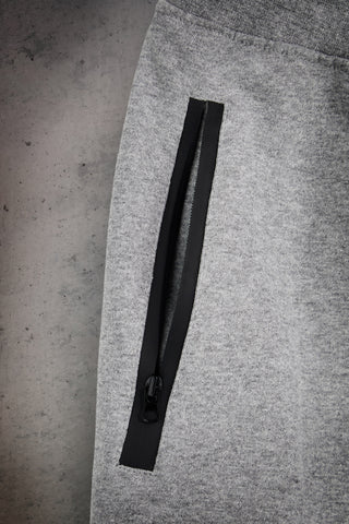 Pantaloni jogger grigi melange in misto cotone felpato con tasche zip Boardman Omertà