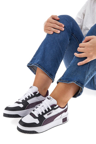 Puma Carina Street weiße und schwarze Turnschuhe