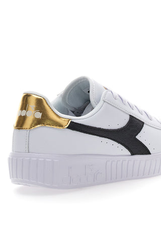 Sneakers Bianche con Logo Nero e Oro DIADORA GAME STEP SKIN GS