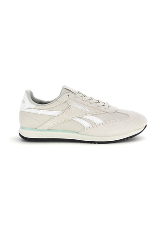 Graue Turnschuhe mit Wildledereinsätzen und schwarzer Sohle Reebok World 70