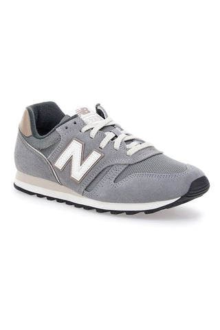 Graue New Balance 373-Sneaker mit Einsätzen aus echtem Leder