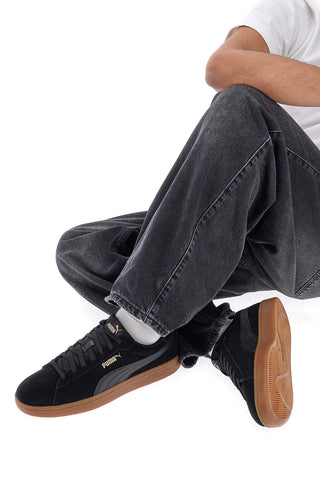 Schwarze Sneaker mit brauner Puma Smash 3.0-Sohle