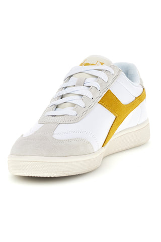 Weiße Turnschuhe mit gelbem Einsatz Diadora Kick Sl