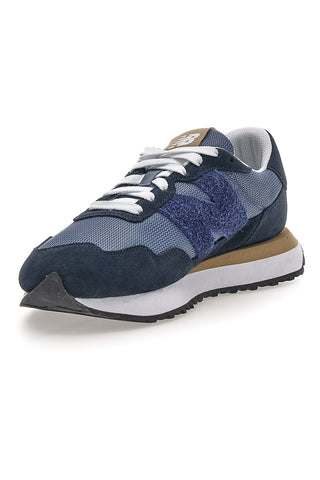 Sneaker blu inserti in pelle New balance M2374EK