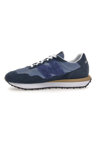 Sneaker blu inserti in pelle New balance M2374EK