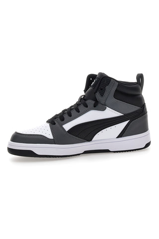 Puma Rebound V6, schwarz-weiße Mid-Cut-Sneaker mit kontrastierenden Einsätzen