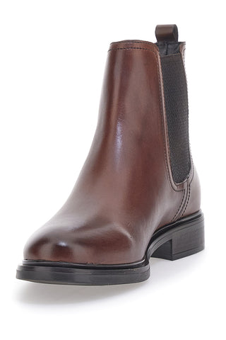 Braune Beatles-Stiefeletten aus echtem Leder im Café kosten 468
